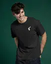 studio-lighting-t-shirt-mockup-smiling-man-wearing-white-tee-on-dark-green-backdrop-modern-fit-style-with-relaxed-pose-casual-fashion-vibe-01553.webp